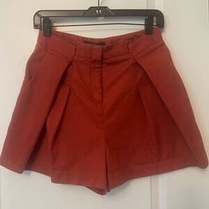 BCBG pleated shorts. NWT High waisted burnt orange shorts.
